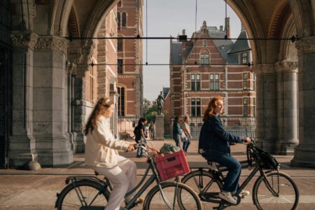 women on bicycles on the streets of amsterdam the netherlands